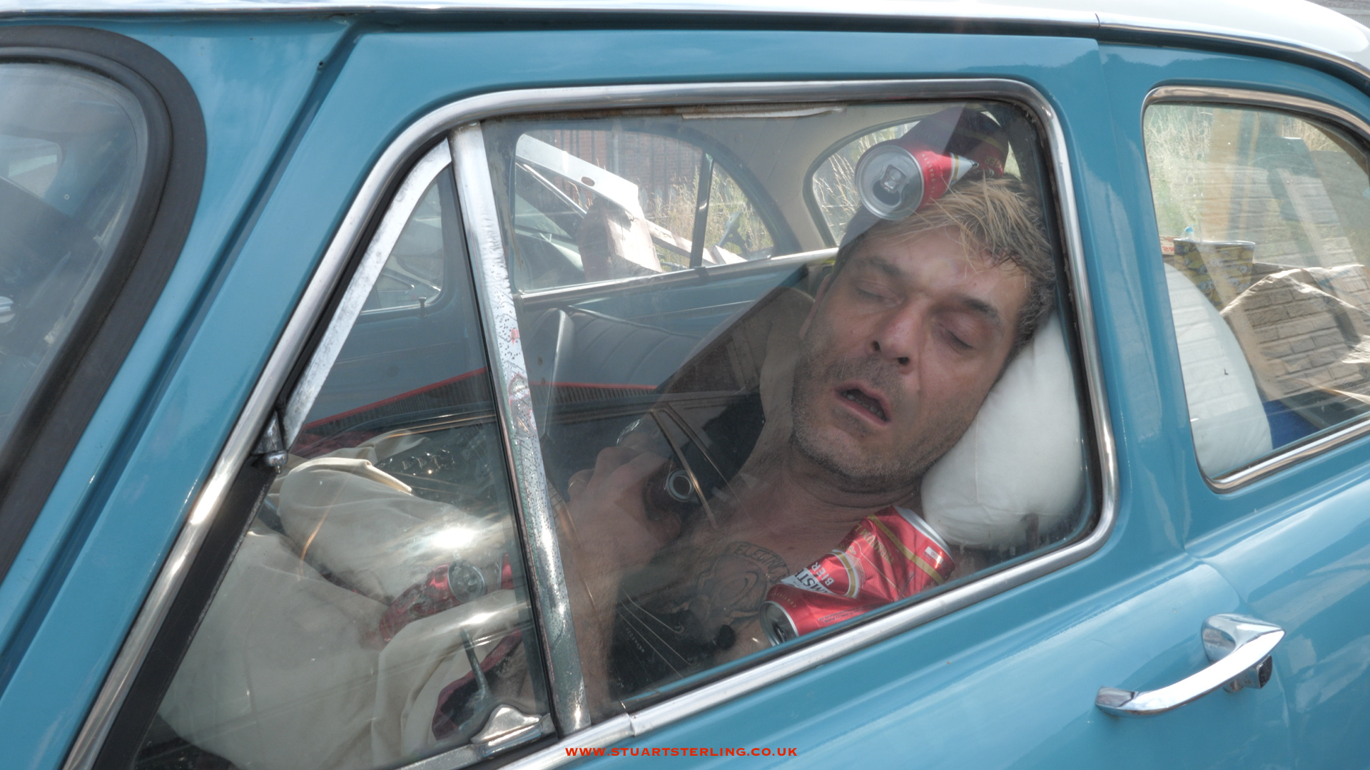 Live in a car still from a music video punk's not dead